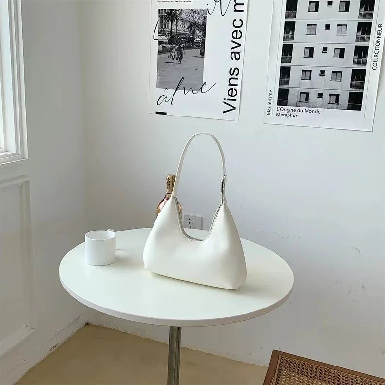 Elegant and sophisticated half-moon shaped handbags.