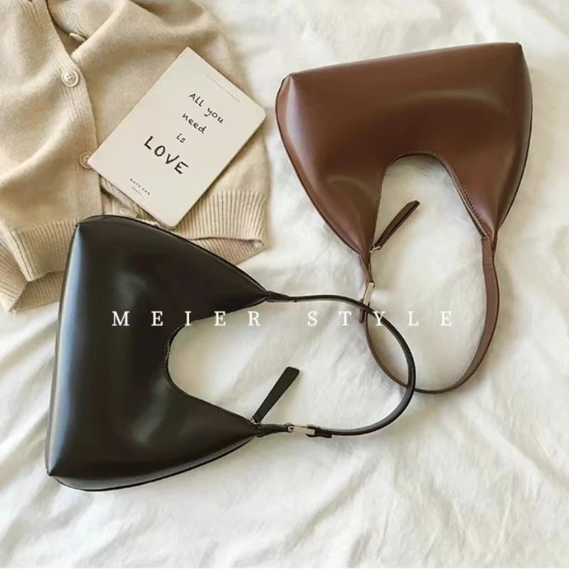 Elegant and sophisticated half-moon shaped handbags.