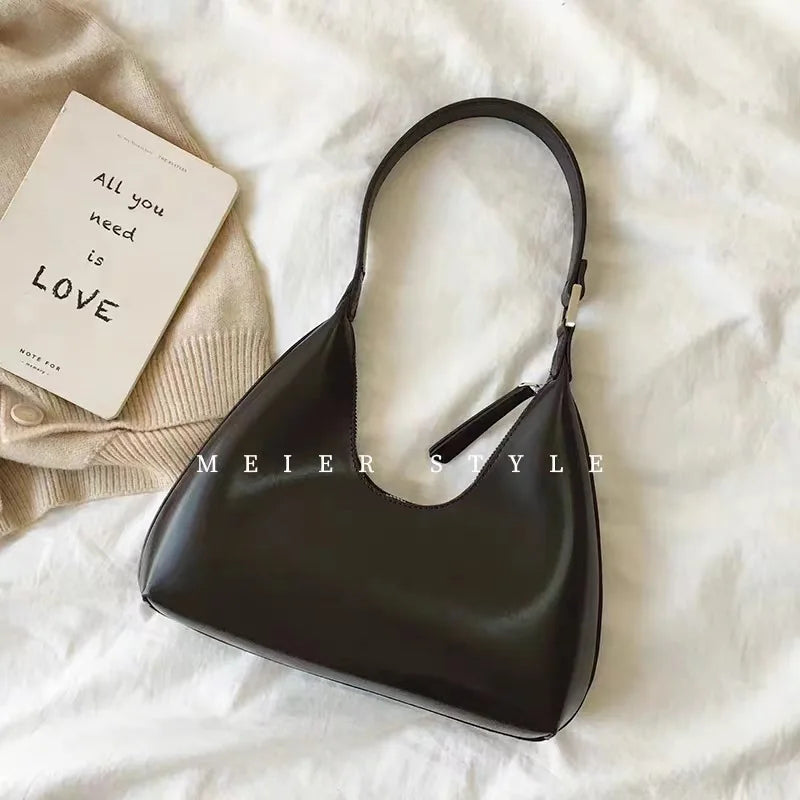 Elegant and sophisticated half-moon shaped handbags.