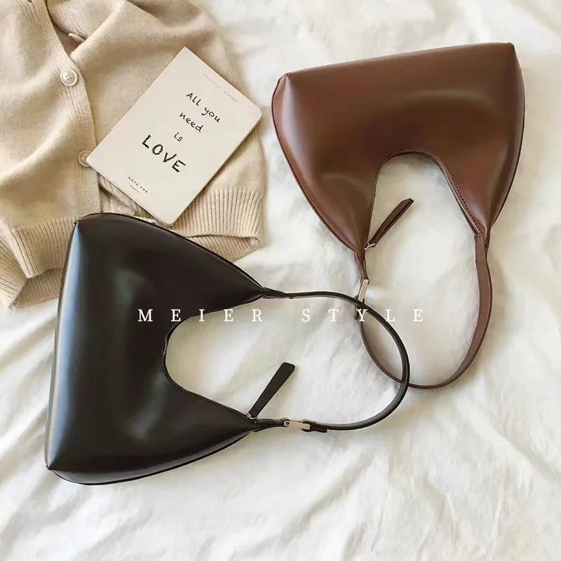 Elegant and sophisticated half-moon shaped handbags.