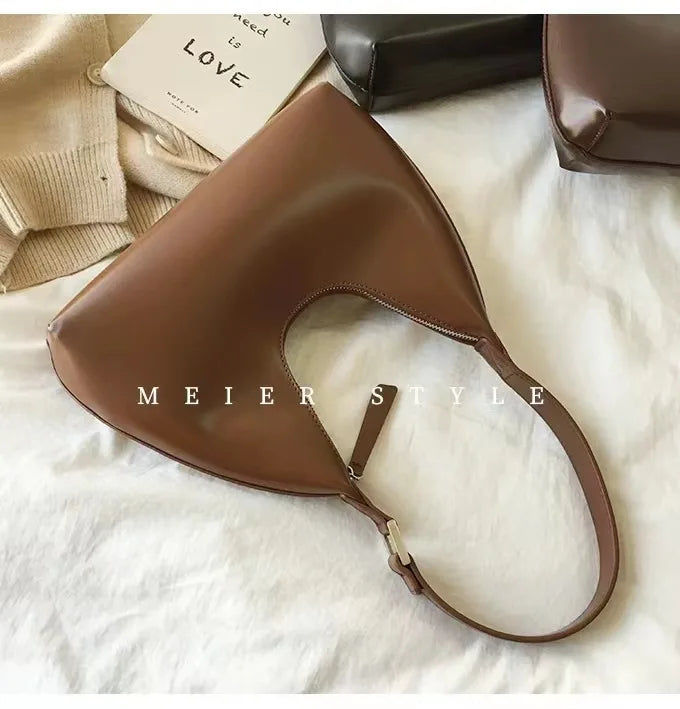 Elegant and sophisticated half-moon shaped handbags.