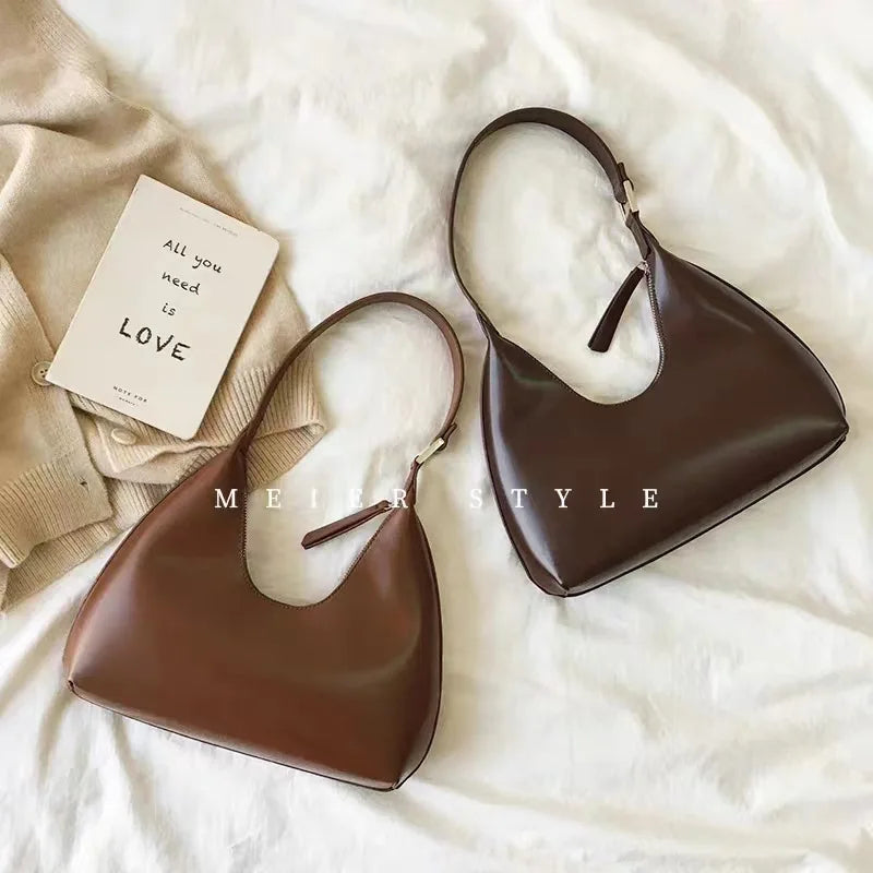 Elegant and sophisticated half-moon shaped handbags.