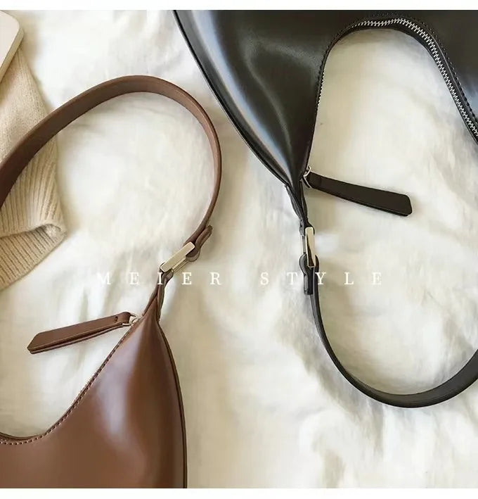 Elegant and sophisticated half-moon shaped handbags.